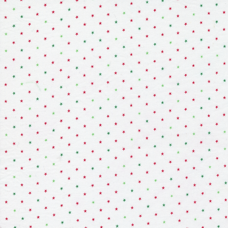 Christmas fabric with small red and green stars all over a white background