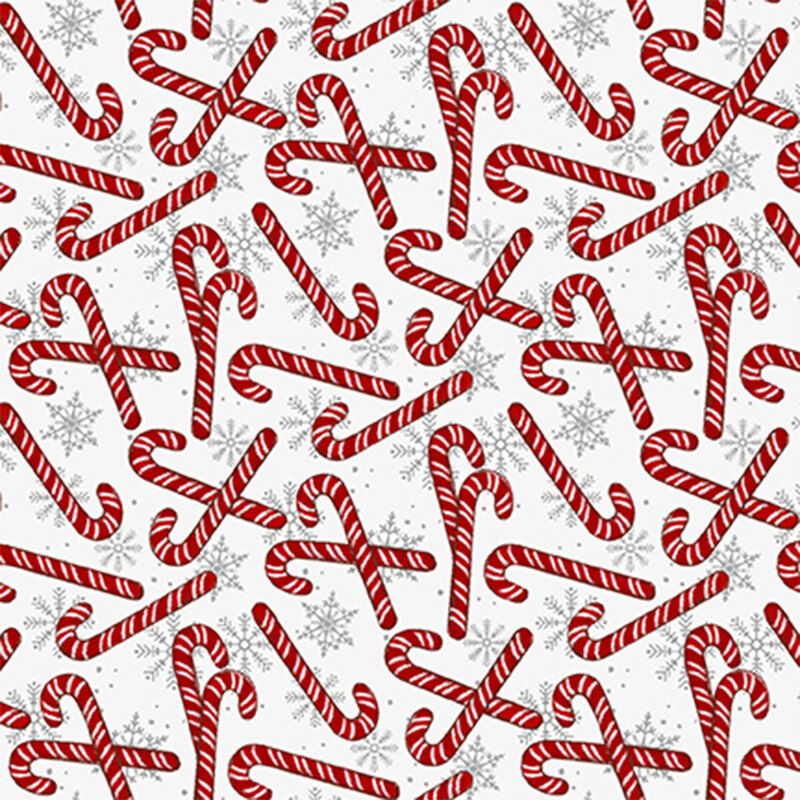 Tossed candy canes and snowflakes all over a white background