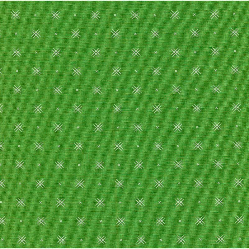 Kelly green fabric with rows of small white x's and double criss-cross patterns