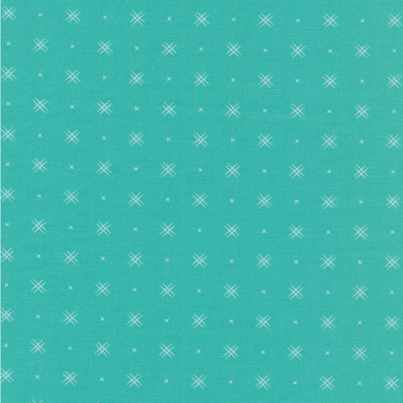 Aqua colored fabric with rows of small white x's and double criss-cross patterns
