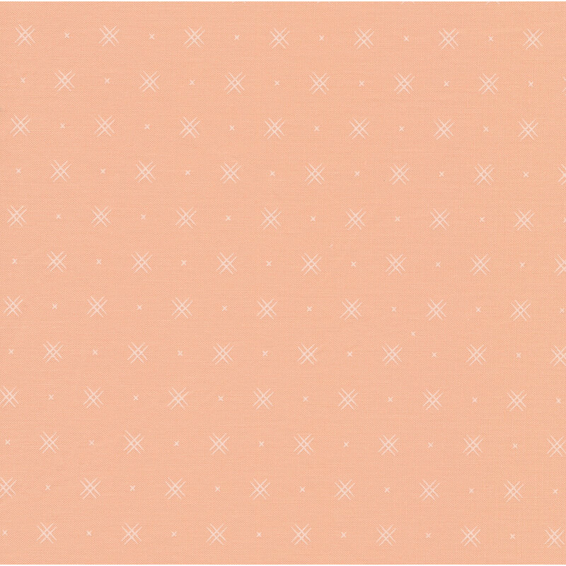 Light peach fabric with rows of small white x's and double criss-cross patterns