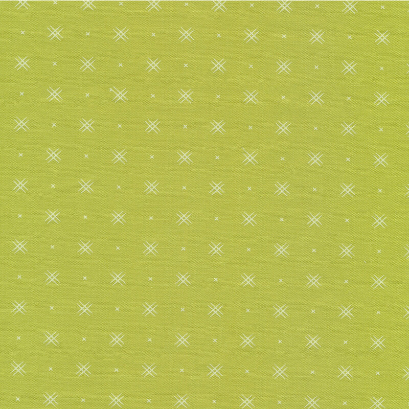Green fabric with rows of small white x's and double criss-cross patterns