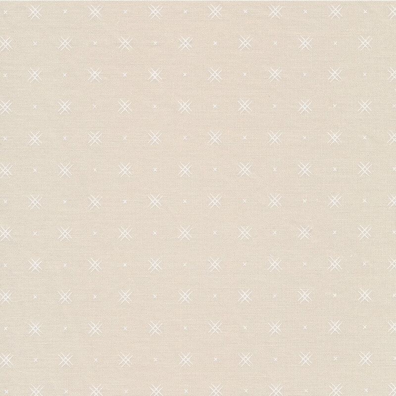 Stone colored fabric with rows of small white x's and double criss-cross patterns