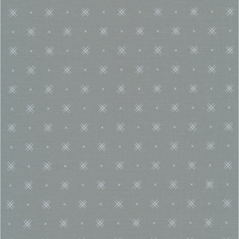 Gray fabric with rows of small white x's and double criss-cross patterns
