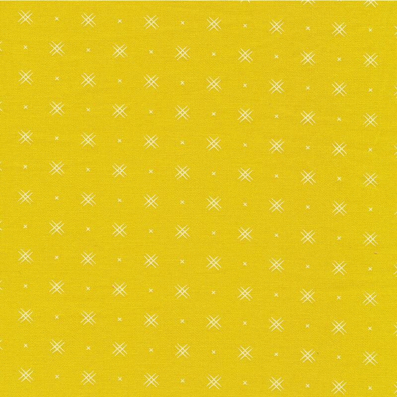 Bright yellow fabric with rows of small white x's and double criss-cross patterns