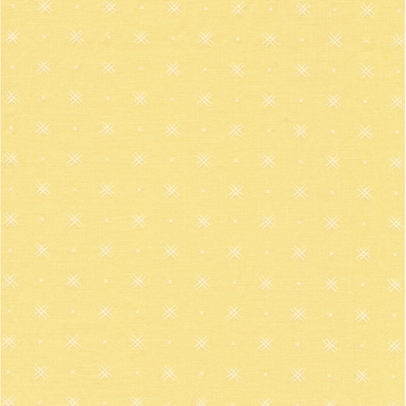 Light yellow fabric with rows of small white x's and double criss-cross patterns