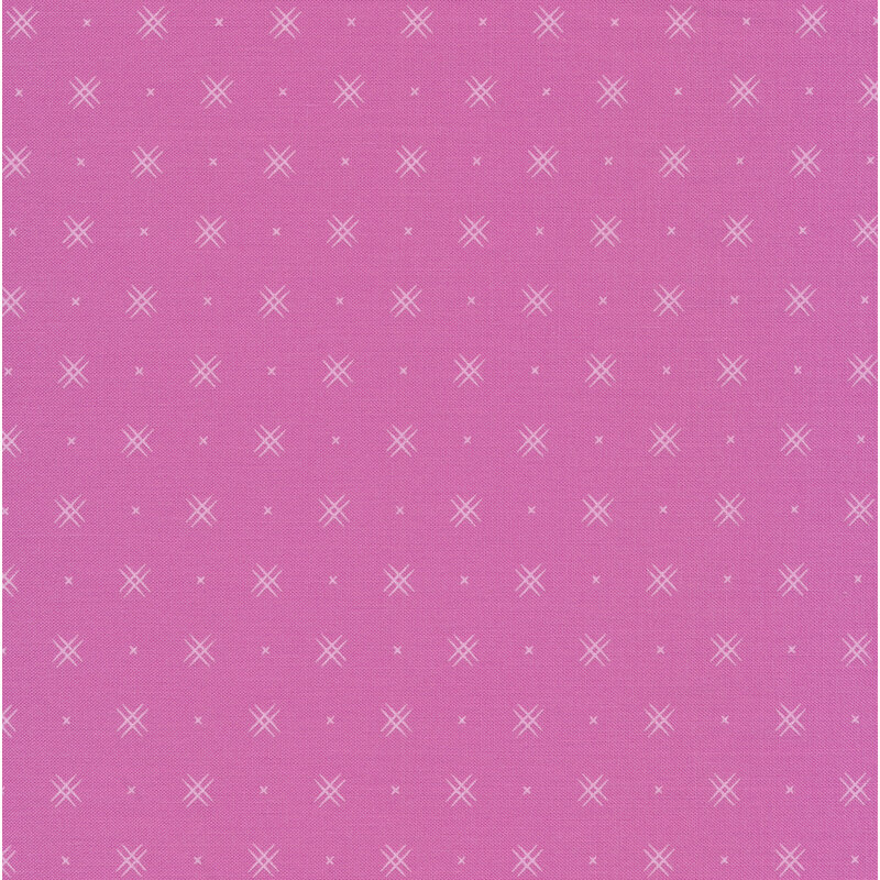 Pink fabric with rows of small white x's and double criss-cross patterns