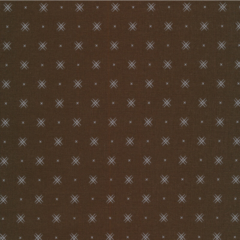 Dark Brown fabric with rows of small white x's and double criss-cross patterns