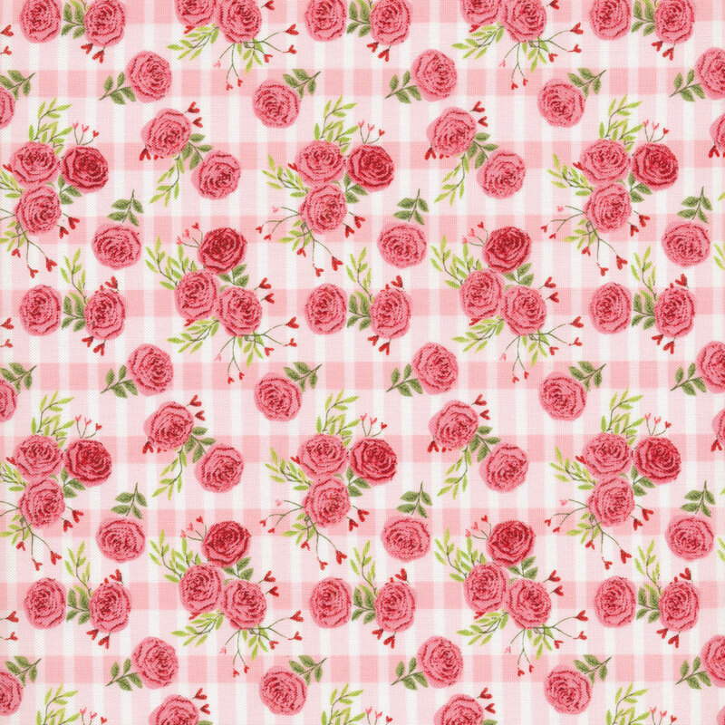 Tossed rose bunches with small hearts on a pink and white plaid background