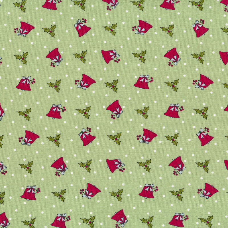 Tossed red winter bells with tossed holly on a light green background