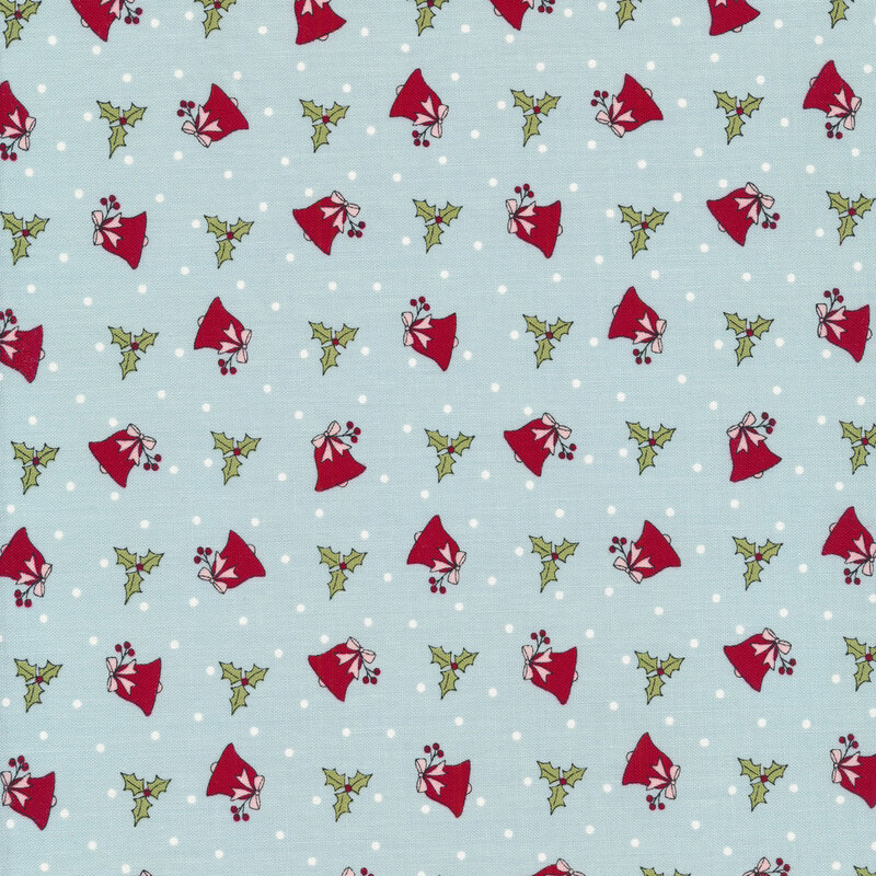 Tossed red winter bells with tossed holly on a light blue background