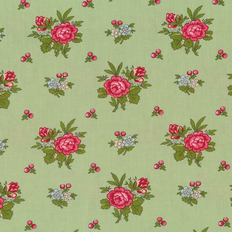 Tossed pink rose bunches and holly berries on a green background
