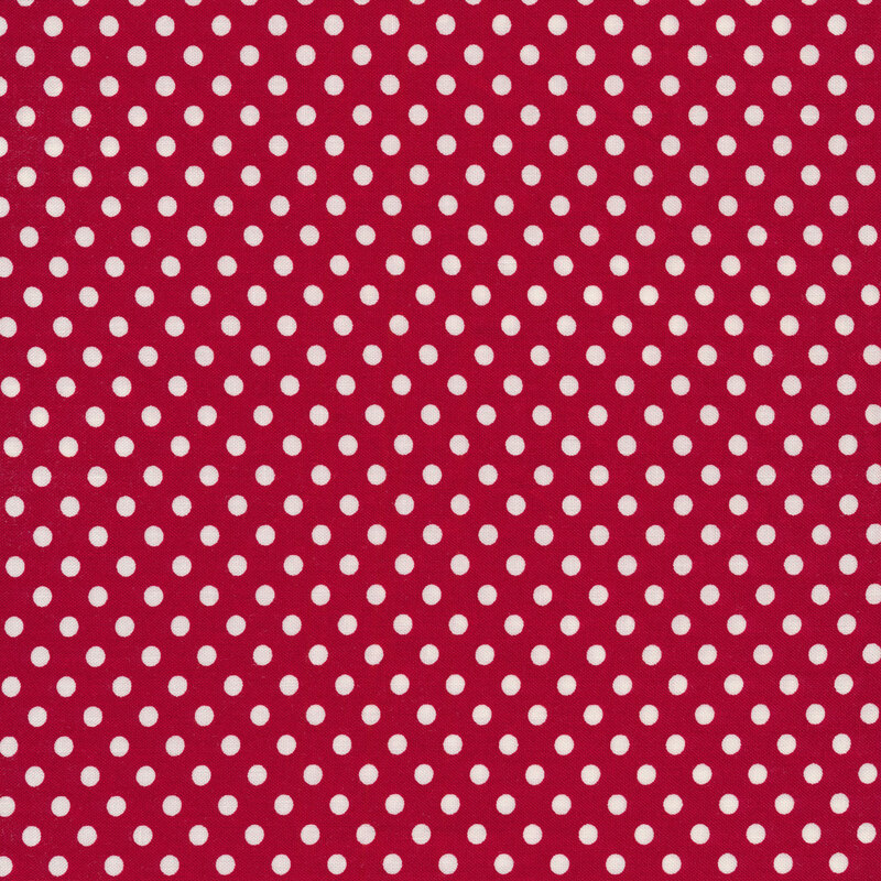 White polka dots on a red background