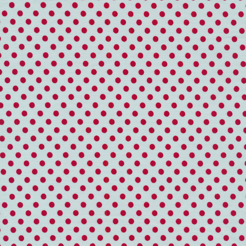 Red polka dots on a blue background