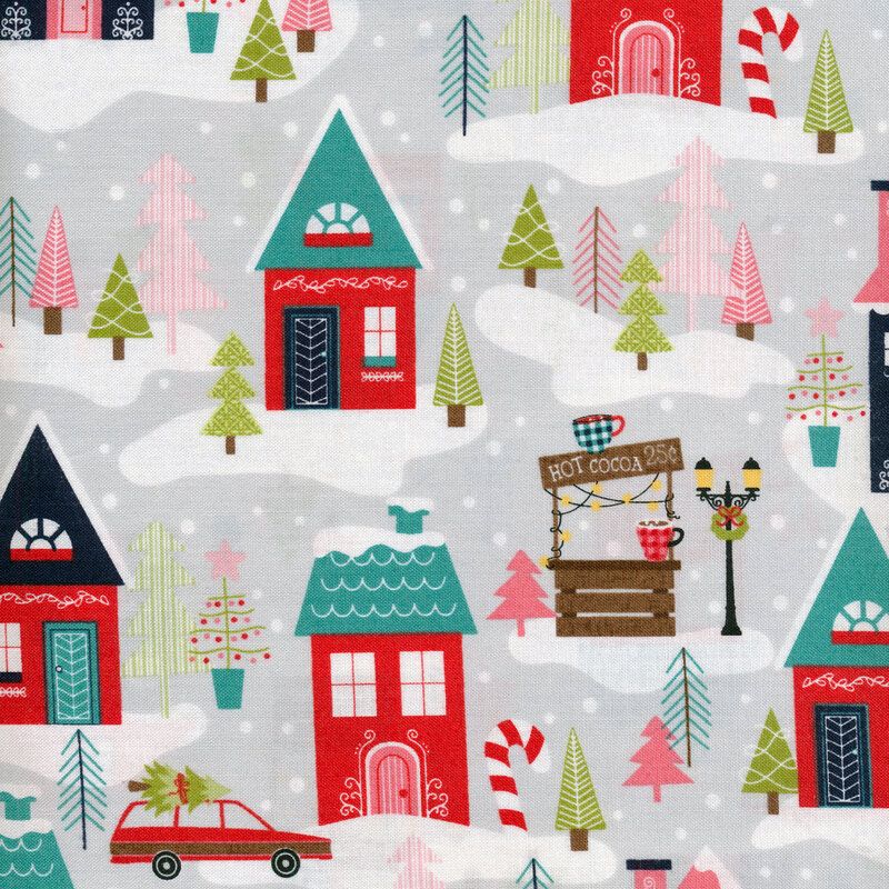 Grey fabric with classic homes and cars full of presents surrounded by falling snow