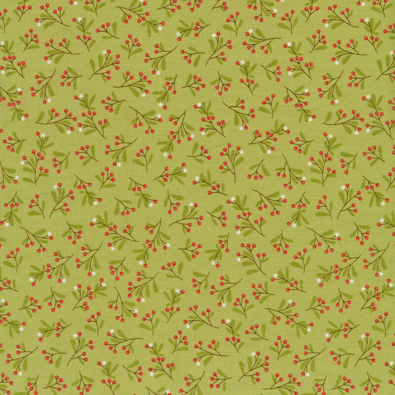 Green fabric with tossed berries and sprigs