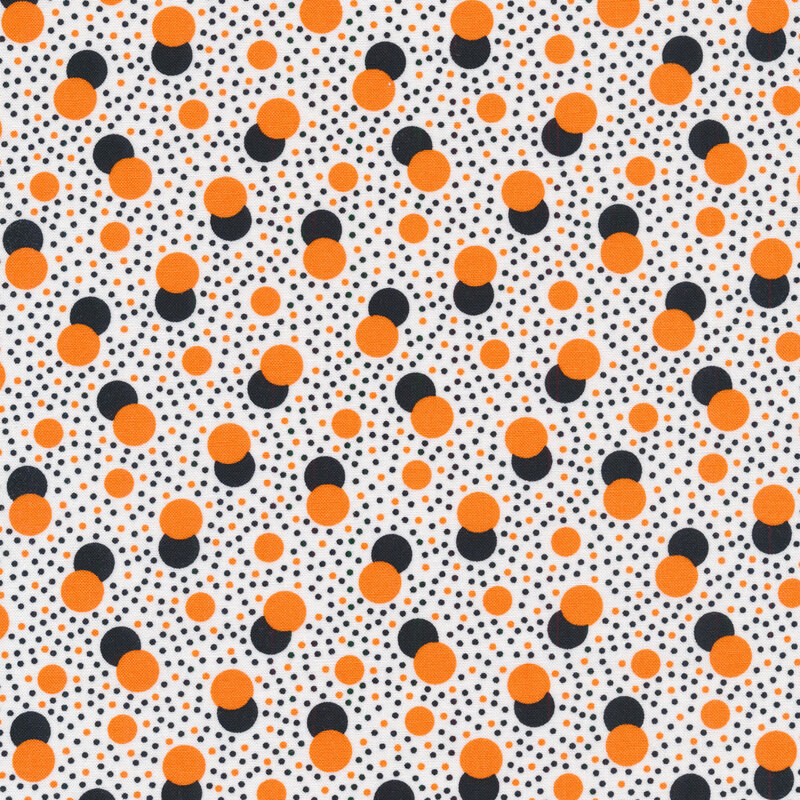 White fabric with black and orange polka dots
