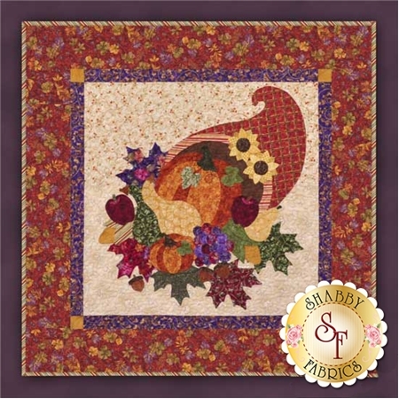 Orange cornucopia on cream filled with pumpkins, gourds, apples, and grapes.