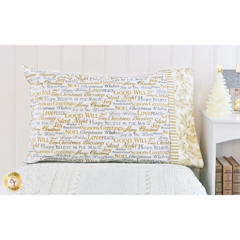 White pillowcase featuring holiday phrases.