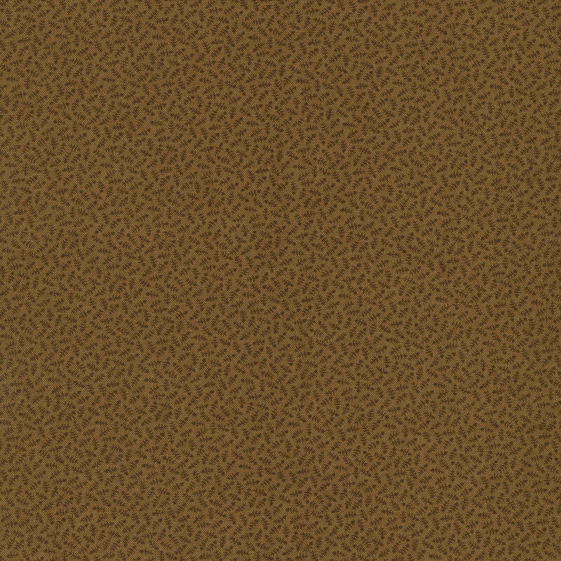 Brown fabric with small tonal dark brown leaves all over