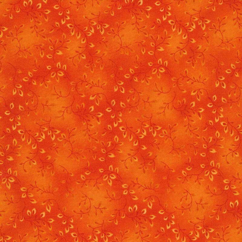 Orange mottled fabric with small leaves and vines all over