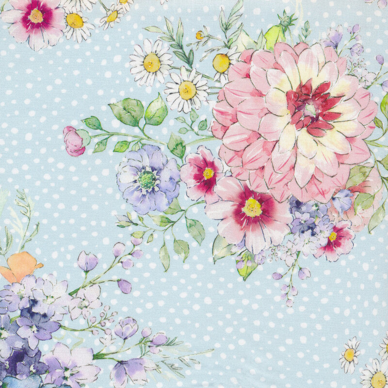 Light blue fabric with small white dots all over and bunches of colorful flowers and leaves