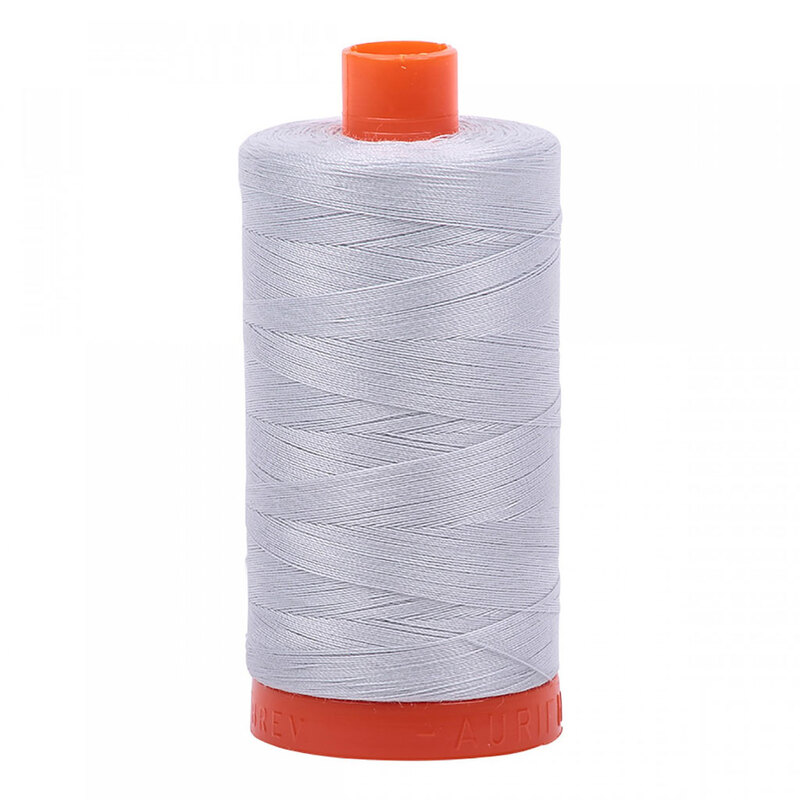 A spool of Aurifil 2600 - Dove thread on a white background