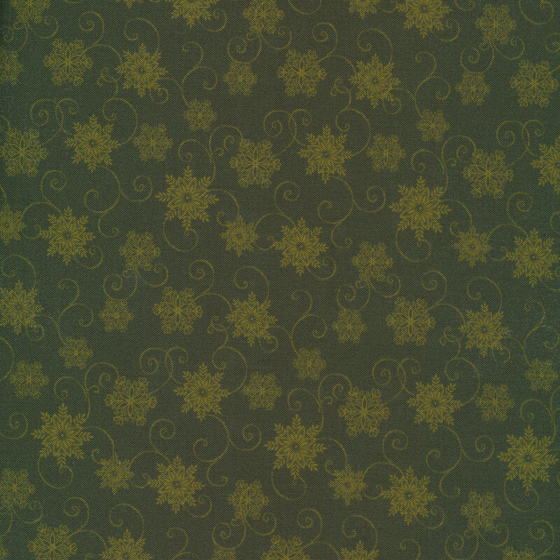 Tonal green fabric with light green snowflakes and scrolls on a dark green background