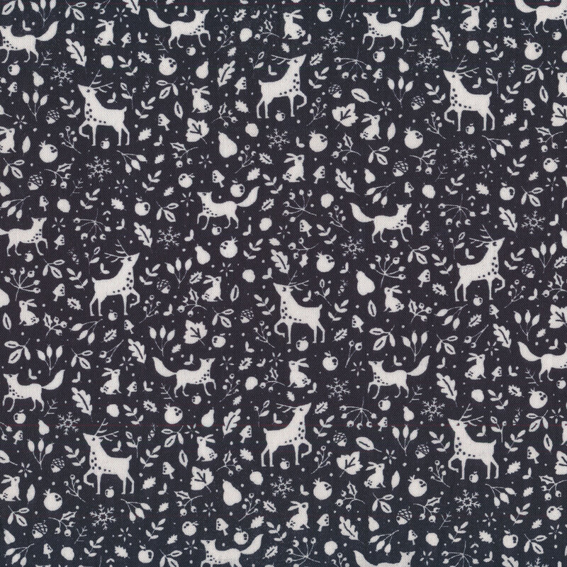 Black fabric with white winter animals, leaves, vines, nuts, and snowflakes all over
