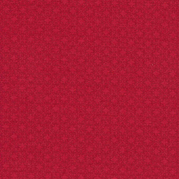 Tonal red fabric with a swirled star lattice design