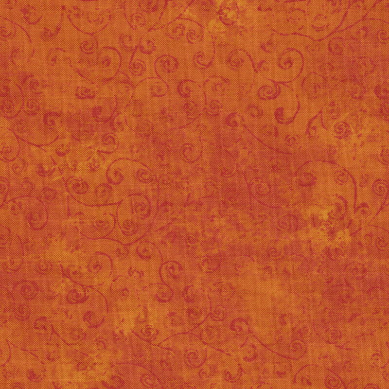 Orange fabric with swirled vines.