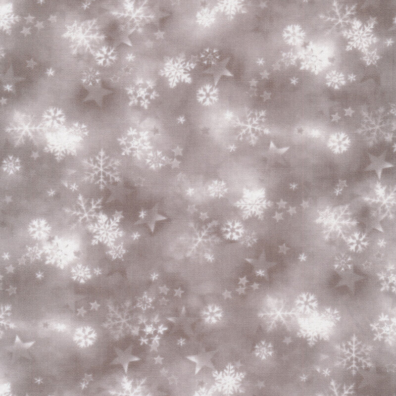 Mottled beige fabric of snowflakes and stars