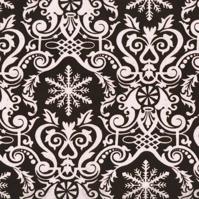 Fabric of a damask print with snowflakes, hearts, and peppermint candies on a black background