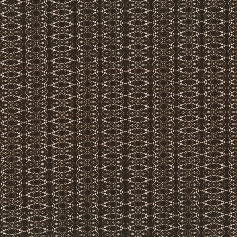 Fabric of a geometric ellipse pattern made out of dots on a black background