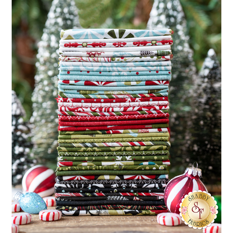 A stack of Christmas fabrics from the Peppermint Bark collection.