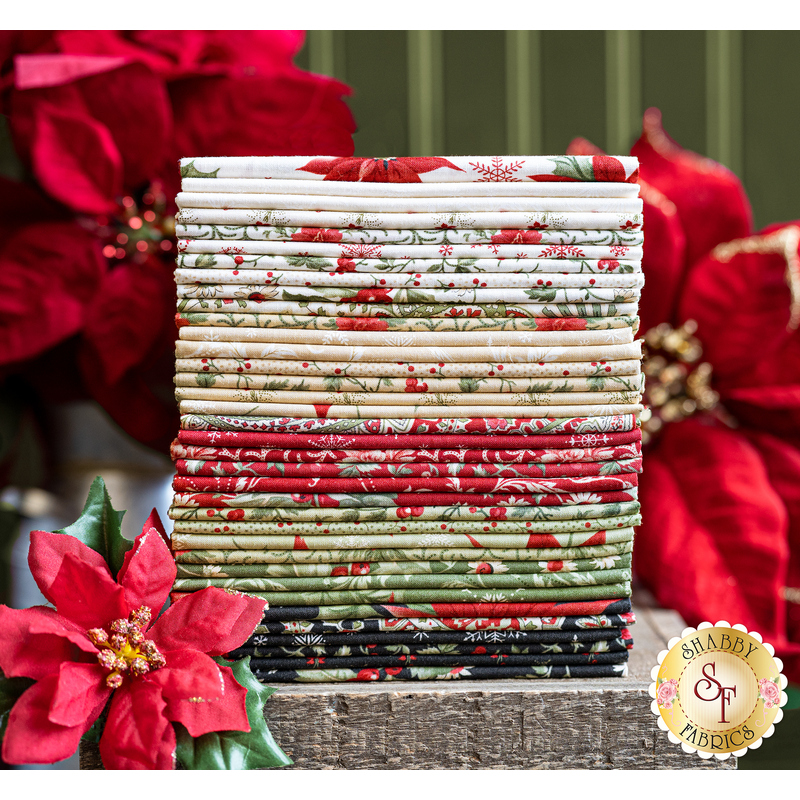 A stack of Christmas fabrics included in the Poinsettia Plaza fabric collection