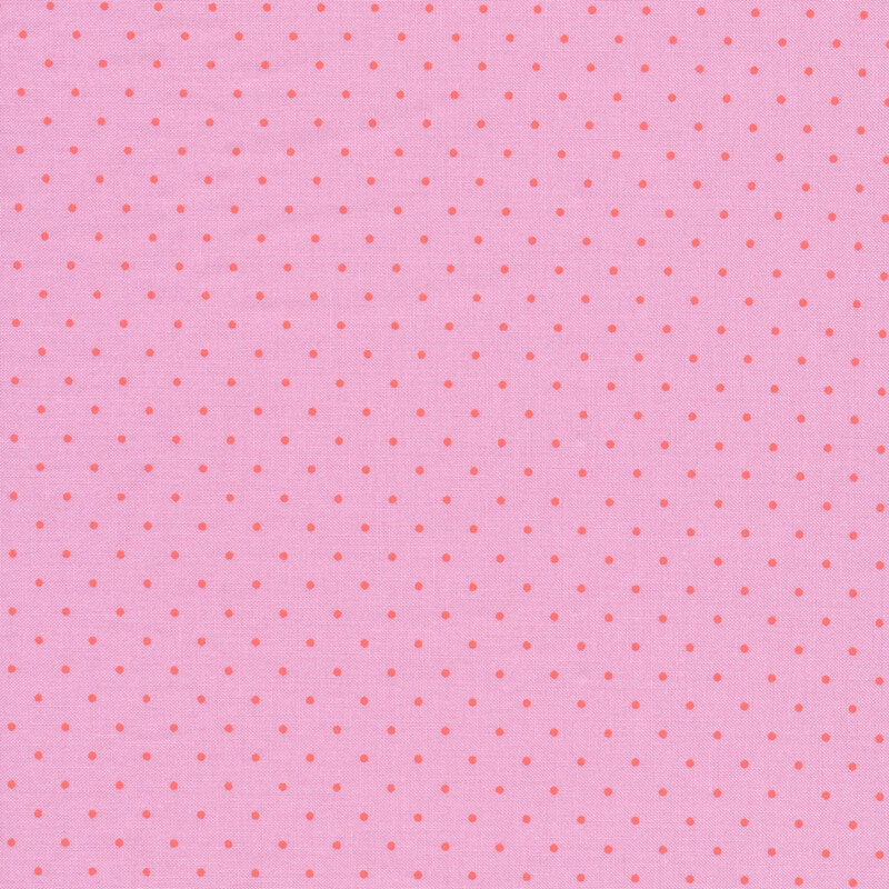 Bright pink fabric with small red polka dots all over