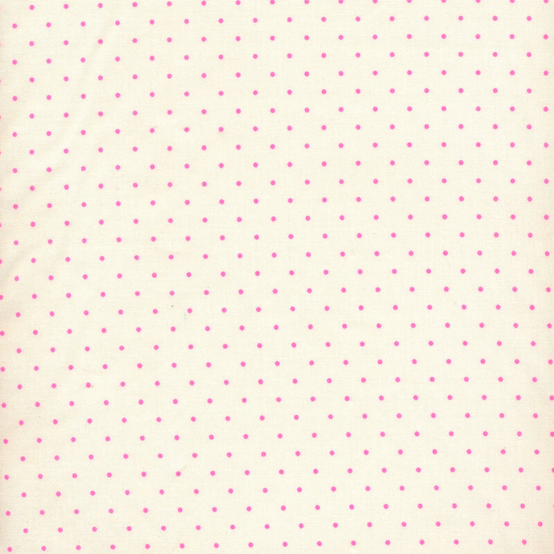 Cream colored fabric with small pink polka dots all over