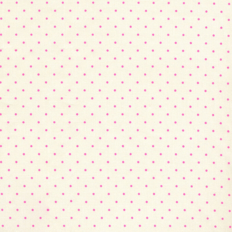 Cream colored fabric with small pink polka dots all over