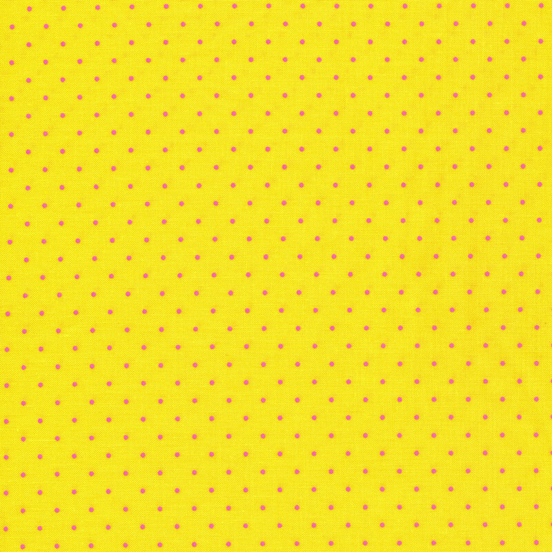 Bright yellow fabric with small pink polka dots all over