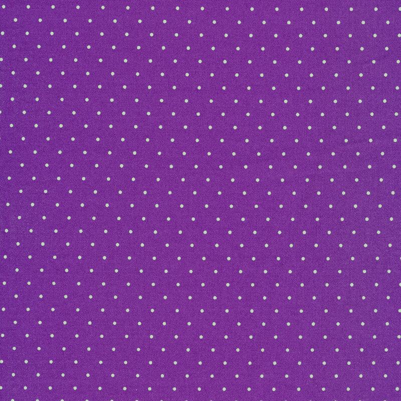 Purple fabric with small aqua polka dots all over