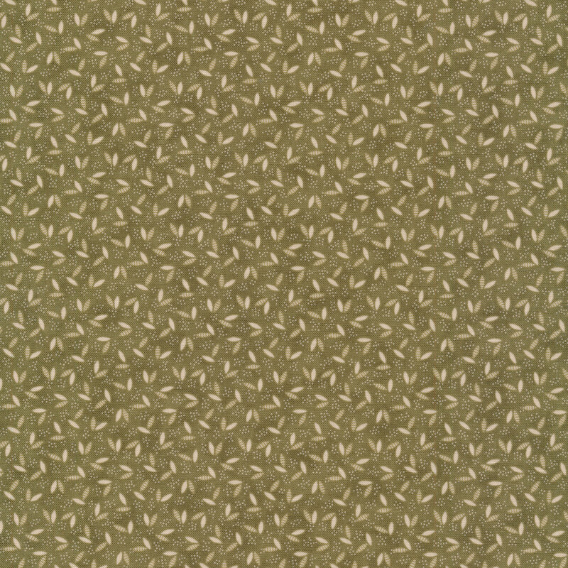 Green fabric with cream leaves tossed all over