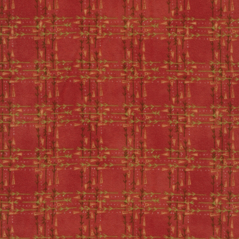 Flannel fabric of lines of carrots and twigs on a red background