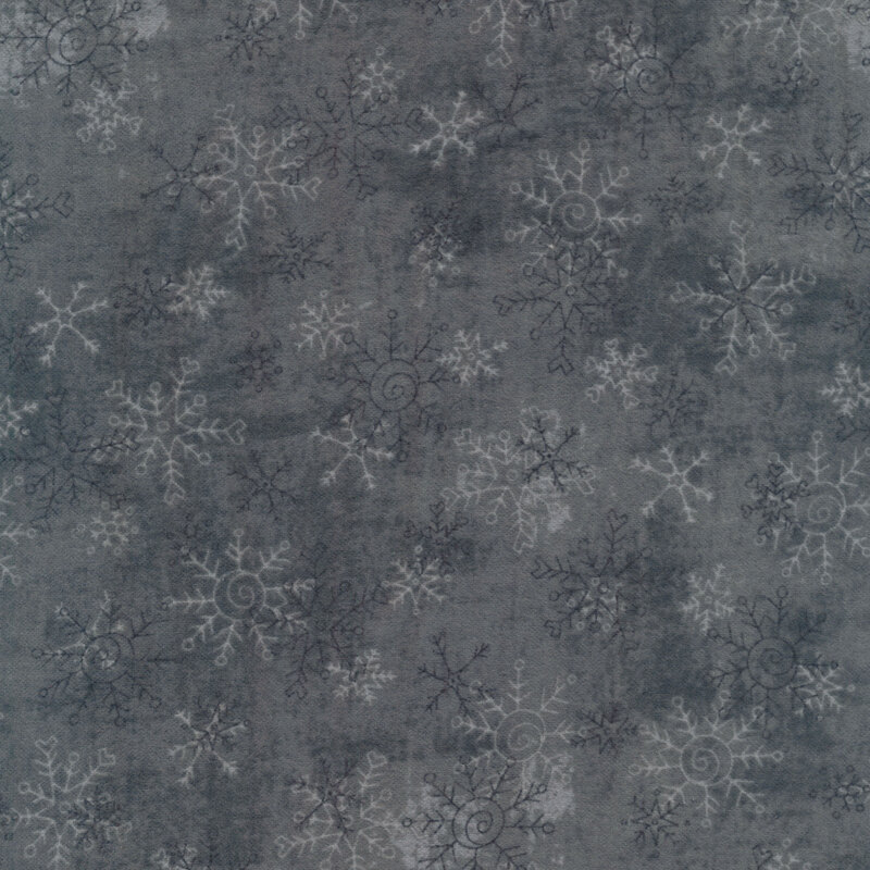Flannel fabric of navy gray and white snowflakes on a gray background