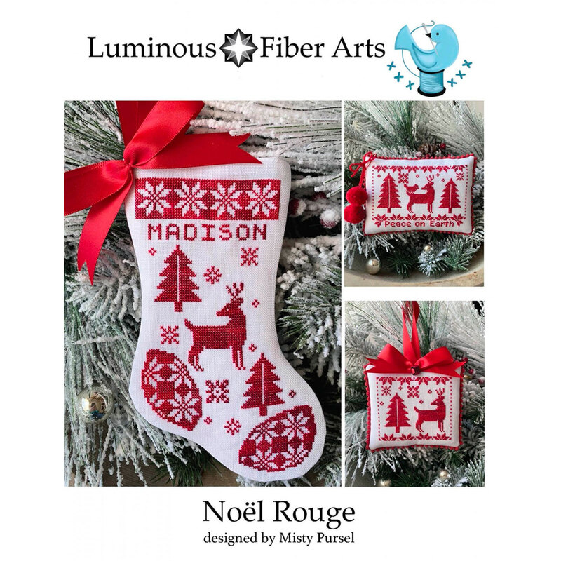 The front of the Noel Rouge cross stitch pattern with the final cross stitch projects displayed on the boughs of a Christmas tree.