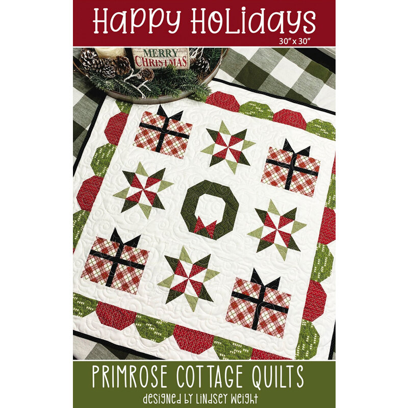 The front of the Happy Holidays pattern by Primrose Cottage Quilts showing the finished quilt.