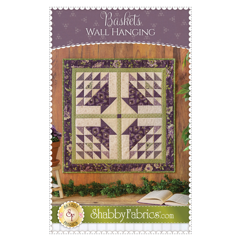 The front of the Baskets Wall Hanging Pattern by Shabby Fabrics showing the finished wall hanging with 4 pieced baskets.