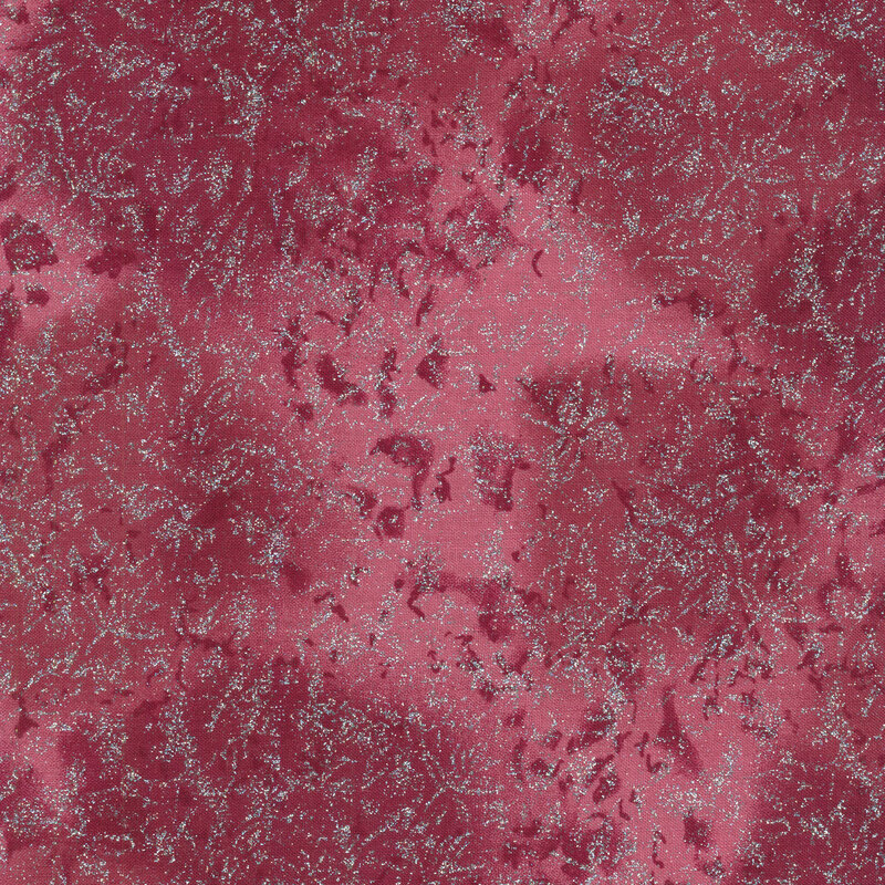 Tonal reddish pink fabric with mottling and metallic glitter accents