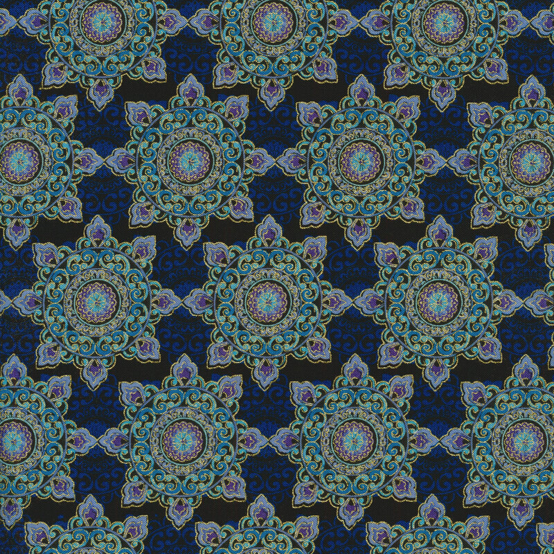 blue purple and green geometric medallions on a black and blue fabric background