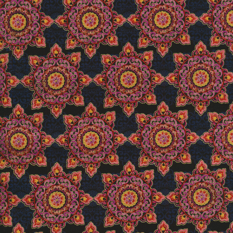 red, pink and orange geometric medallions on a black and gray fabric background